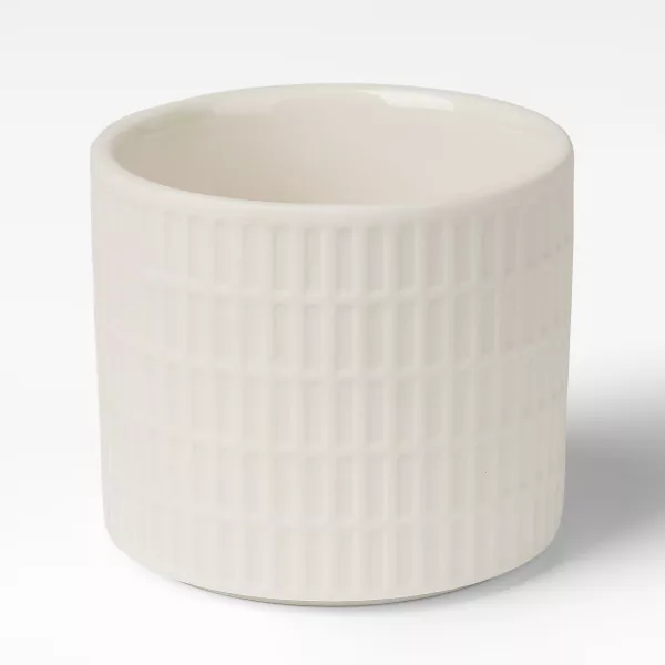 Bougeoirs en céramique à motif de grille blanc laiteux Bougeoirs en céramique à motif de grille blanc laiteux