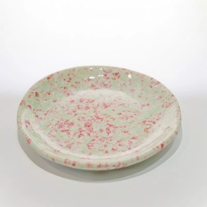 Petit plat rond en céramique mouchetée